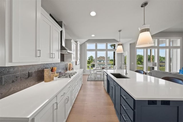 4275 Lake Shore Ct, Basehor, KS 66007 - kitchen with a sink, white cabinetry, a kitchen island with sink, light countertops, and recessed lighting