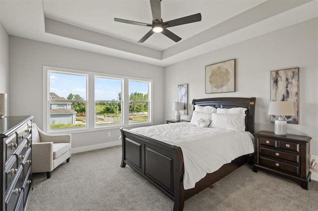 4275 Lake Shore Ct, Basehor, KS 66007 - bedroom featuring light carpet, a tray ceiling, baseboards, and ceiling fan