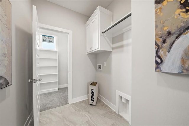 4275 Lake Shore Ct, Basehor, KS 66007 - laundry room with cabinet space, hookup for a washing machine, baseboards, and light marble finish flooring