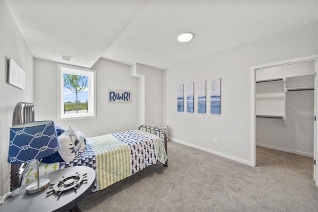 4275 Lake Shore Ct, Basehor, KS 66007 - bedroom with carpet flooring, baseboards, and a walk in closet