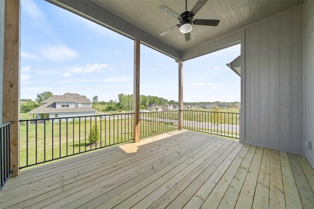 4275 Lake Shore Ct, Basehor, KS 66007 - wooden deck with ceiling fan and a yard