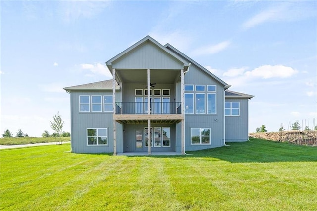 4275 Lake Shore Ct, Basehor, KS 66007 - rear view of house featuring a ceiling fan, a yard, and a balcony