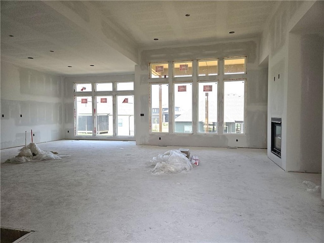 4275 Lake Shore Ct, Basehor, KS 66007 - unfurnished living room with a glass covered fireplace
