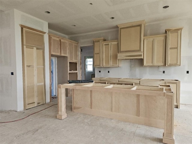 4275 Lake Shore Ct, Basehor, KS 66007 - kitchen featuring a center island, light brown cabinetry, and under cabinet range hood