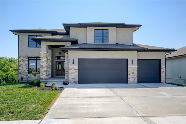 907 Reed Dr, Raymore, MO 64083 - prairie-style house featuring stucco siding, driveway, stone siding, and a front lawn