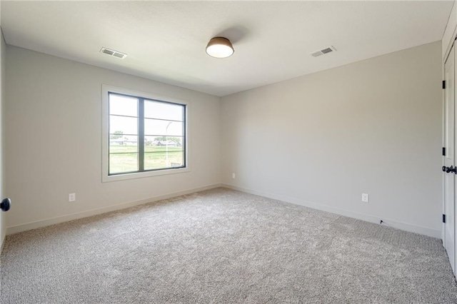 907 Reed Dr, Raymore, MO 64083 - unfurnished room featuring light carpet