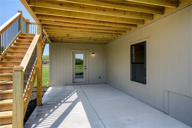 907 Reed Dr, Raymore, MO 64083 - view of patio featuring stairway