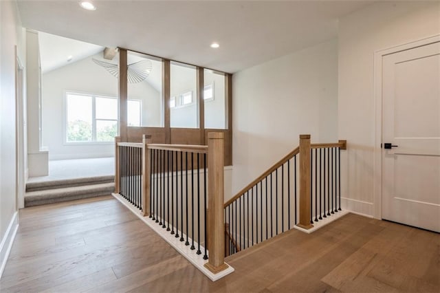 17041 Earnshaw St, Overland Park, KS 66221 - staircase with wood finished floors, recessed lighting, and lofted ceiling