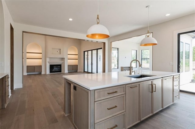 17041 Earnshaw St, Overland Park, KS 66221 - kitchen featuring wood finished floors, light countertops, a center island with sink, and recessed lighting