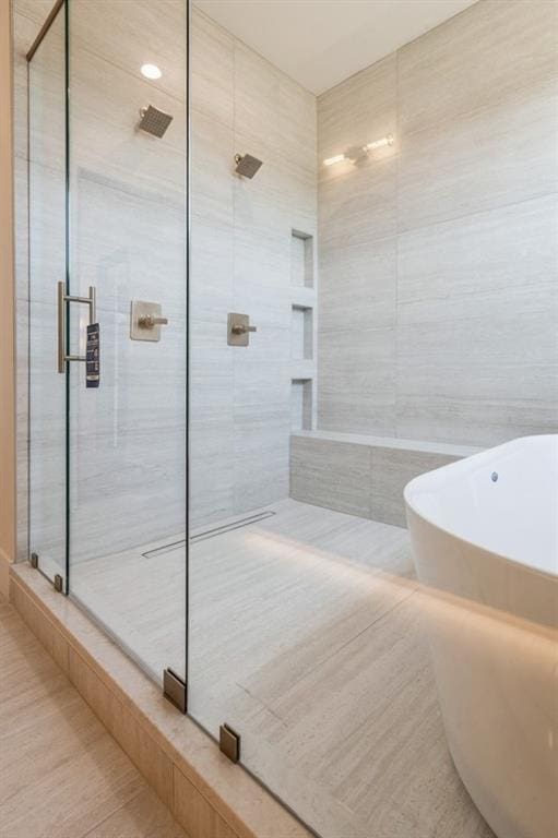 17041 Earnshaw St, Overland Park, KS 66221 - bathroom featuring a shower stall and a freestanding bath