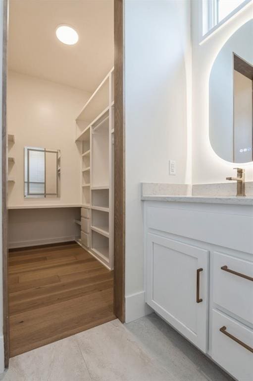 17041 Earnshaw St, Overland Park, KS 66221 - walk in closet with light wood-style flooring