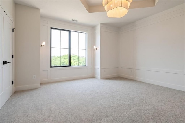 17041 Earnshaw St, Overland Park, KS 66221 - unfurnished room featuring light colored carpet and a decorative wall