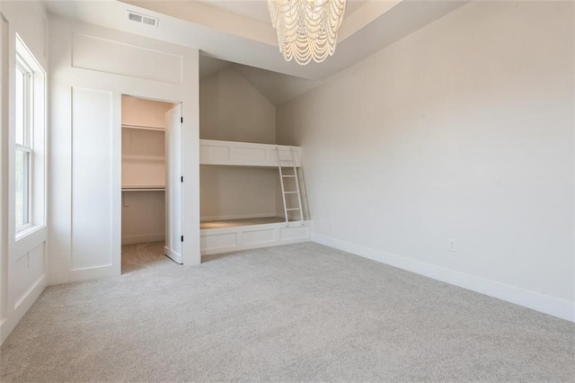 17041 Earnshaw St, Overland Park, KS 66221 - unfurnished bedroom featuring light colored carpet, a chandelier, a spacious closet, and a closet
