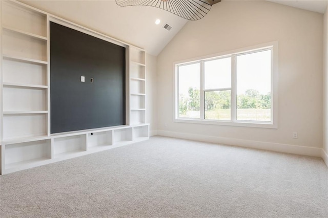 17041 Earnshaw St, Overland Park, KS 66221 - unfurnished living room with lofted ceiling, carpet floors, and built in shelves