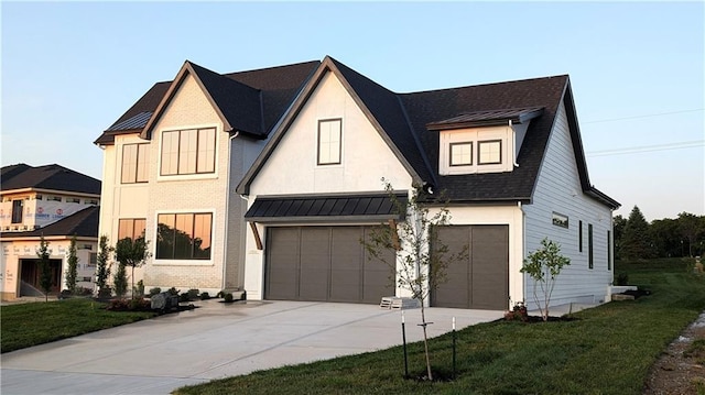 17041 Earnshaw St, Overland Park, KS 66221 - view of front facade featuring an attached garage, concrete driveway, a front lawn, a standing seam roof, and a shingled roof