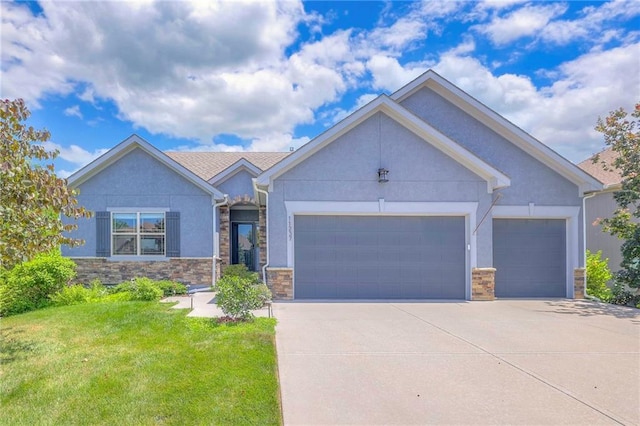11237 S Race St, Olathe, KS 66061 - ranch-style house with stucco siding, an attached garage, concrete driveway, and stone siding