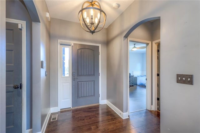 11237 S Race St, Olathe, KS 66061 - entrance foyer with arched walkways, dark wood-style floors, and a chandelier