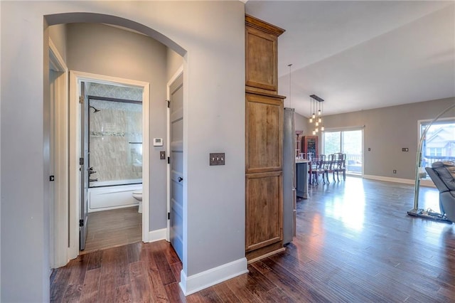 11237 S Race St, Olathe, KS 66061 - corridor featuring arched walkways and dark wood-style flooring