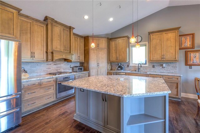 11237 S Race St, Olathe, KS 66061 - kitchen featuring stainless steel appliances, lofted ceiling, a kitchen island, open shelves, and brown cabinetry