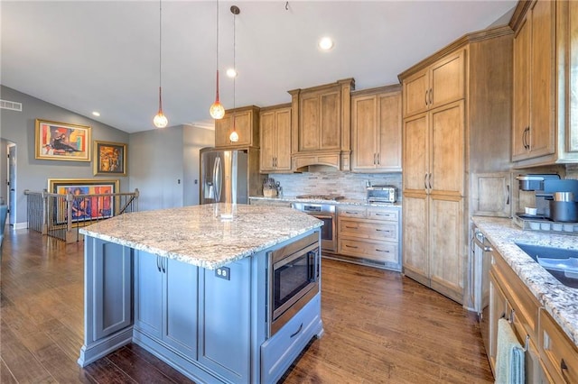 11237 S Race St, Olathe, KS 66061 - kitchen featuring appliances with stainless steel finishes, tasteful backsplash, dark wood-style flooring, brown cabinets, and a kitchen island