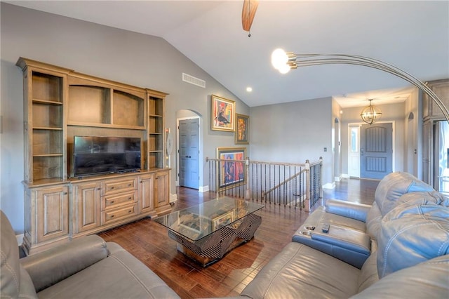 11237 S Race St, Olathe, KS 66061 - living room featuring lofted ceiling, dark wood-type flooring, arched walkways, a chandelier, and recessed lighting