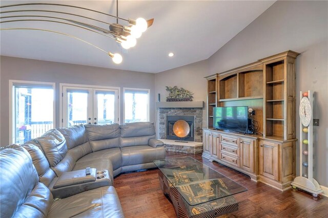 11237 S Race St, Olathe, KS 66061 - living room with dark wood finished floors, french doors, a stone fireplace, and recessed lighting
