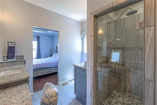 11237 S Race St, Olathe, KS 66061 - bathroom with vanity, tile patterned floors, a stall shower, and ensuite bathroom