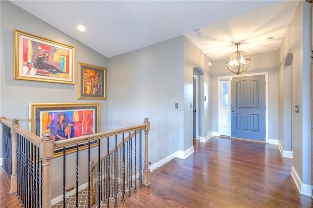 11237 S Race St, Olathe, KS 66061 - foyer with a chandelier, wood finished floors, arched walkways, recessed lighting, and lofted ceiling