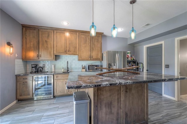 11237 S Race St, Olathe, KS 66061 - kitchen with beverage cooler, stainless steel fridge with ice dispenser, backsplash, and dark stone countertops
