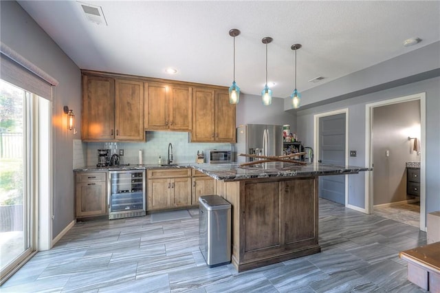 11237 S Race St, Olathe, KS 66061 - kitchen featuring beverage cooler, stainless steel fridge with ice dispenser, a kitchen island, dark stone counters, and backsplash