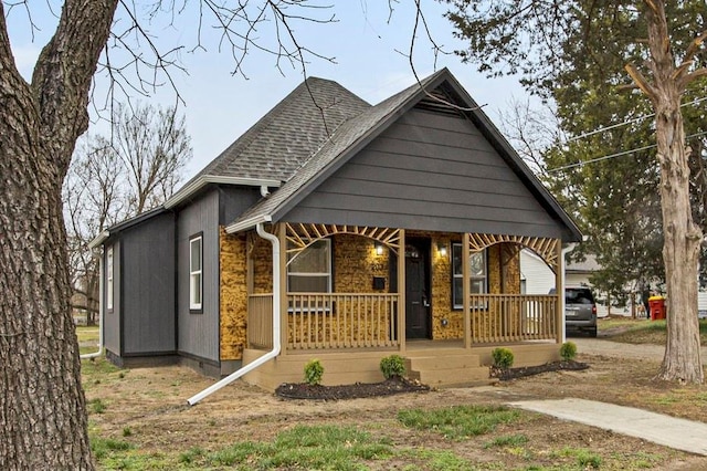203 N Chestnut St, Pittsburg, KS 66762 - view of front of house with a porch and a shingled roof