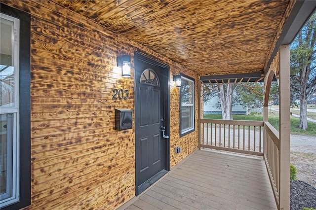 203 N Chestnut St, Pittsburg, KS 66762 - wooden terrace featuring covered porch
