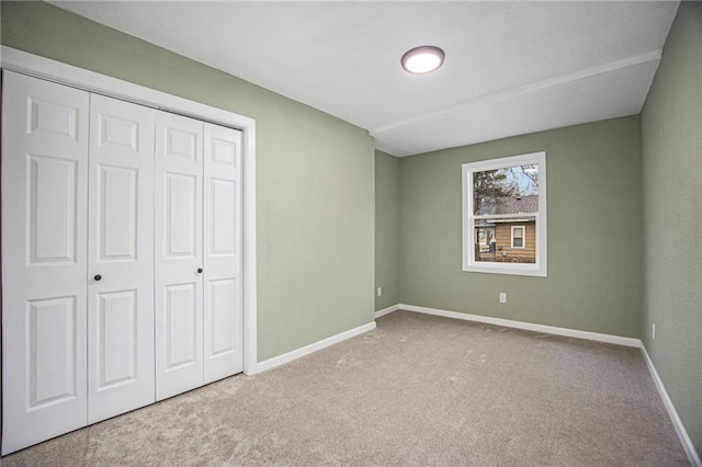 203 N Chestnut St, Pittsburg, KS 66762 - unfurnished bedroom with carpet floors, baseboards, and a closet
