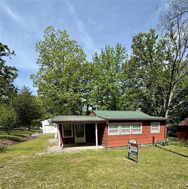 29243 Serene Ave, Warsaw, MO 65355 - rear view of property with a yard and metal roof