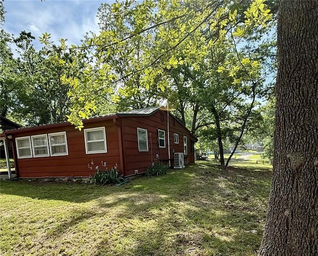 29243 Serene Ave, Warsaw, MO 65355 - view of side of property featuring cooling unit and a yard