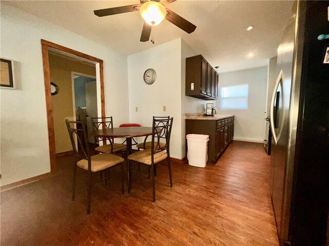 29243 Serene Ave, Warsaw, MO 65355 - dining space with dark wood-style flooring, baseboards, and a ceiling fan