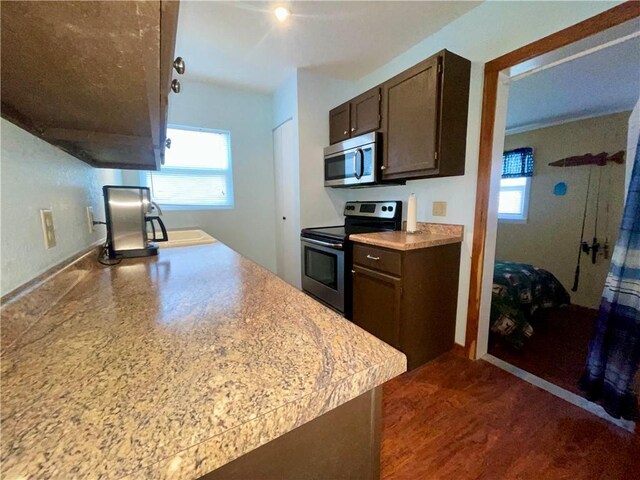 29243 Serene Ave, Warsaw, MO 65355 - kitchen featuring stainless steel appliances, dark brown cabinets, light countertops, and baseboards