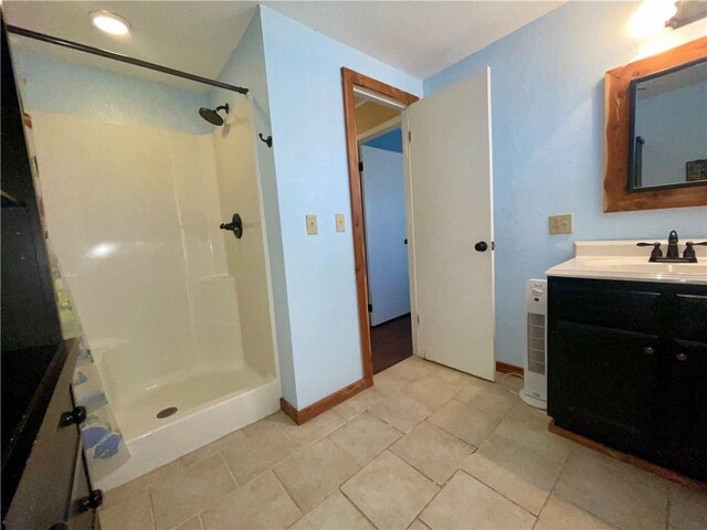 29243 Serene Ave, Warsaw, MO 65355 - full bath with vanity, a walk in shower, and baseboards