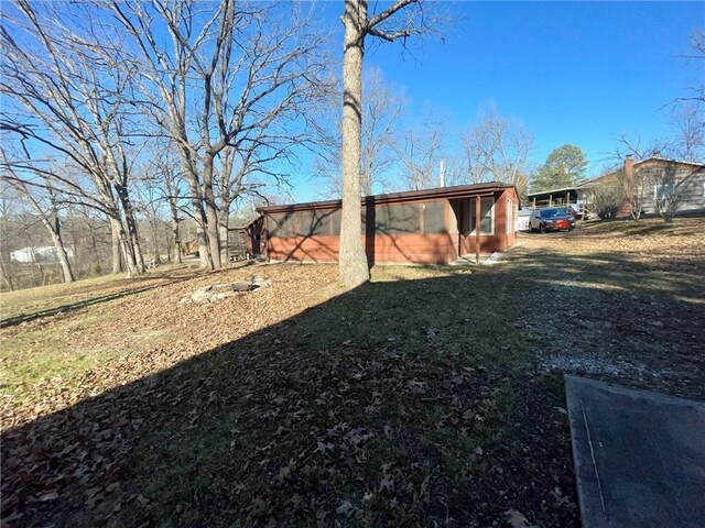29243 Serene Ave, Warsaw, MO 65355 - view of green lawn featuring a sunroom