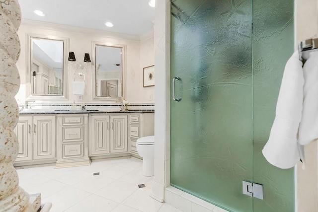 full bath with crown molding, a stall shower, toilet, tile patterned flooring, and double vanity