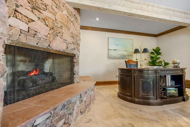 welcome area with crown molding and a fireplace