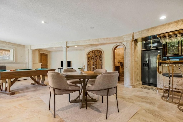 dining area with billiards table, a textured ceiling, bar, and recessed lighting
