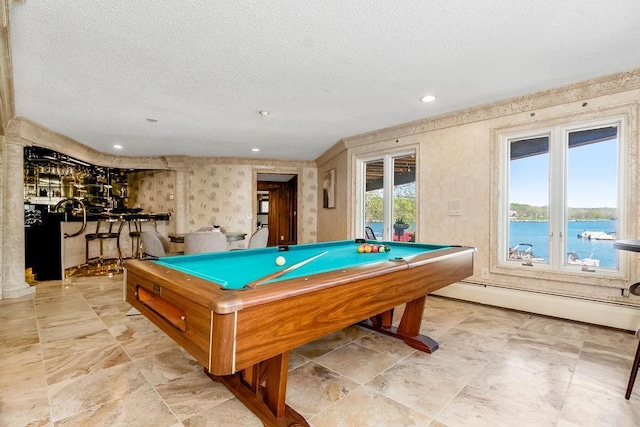 recreation room with a textured ceiling, pool table, a dry bar, baseboard heating, and recessed lighting