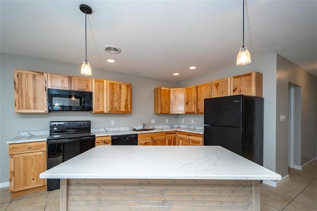 kitchen with visible vents, black appliances, a sink, light countertops, and light tile patterned floors