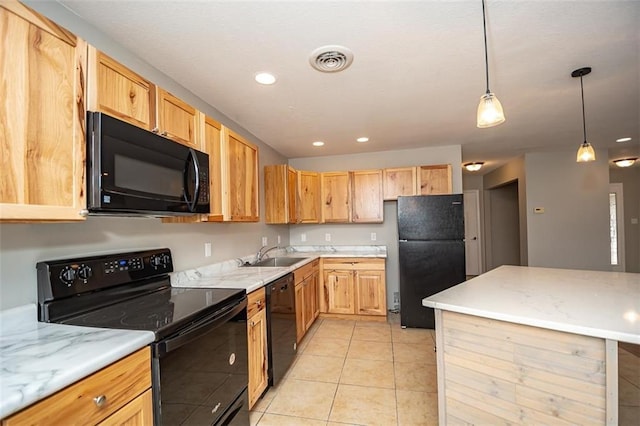 kitchen featuring visible vents, black appliances, a sink, decorative light fixtures, and light tile patterned floors