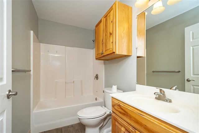 bathroom with shower / bathtub combination, toilet, and vanity