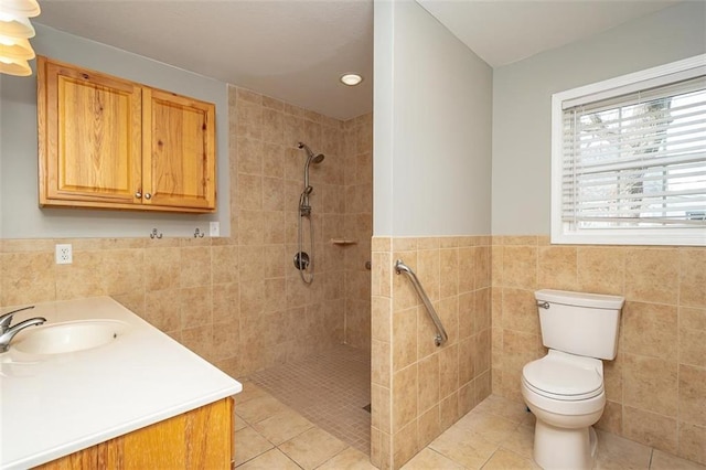 bathroom featuring tile patterned flooring, tile walls, toilet, and tiled shower