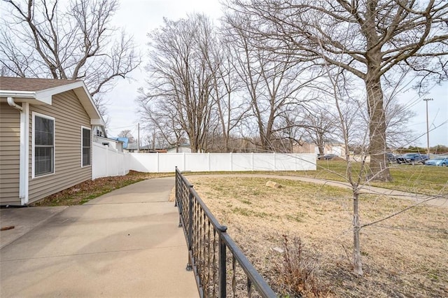 view of yard featuring a patio and fence