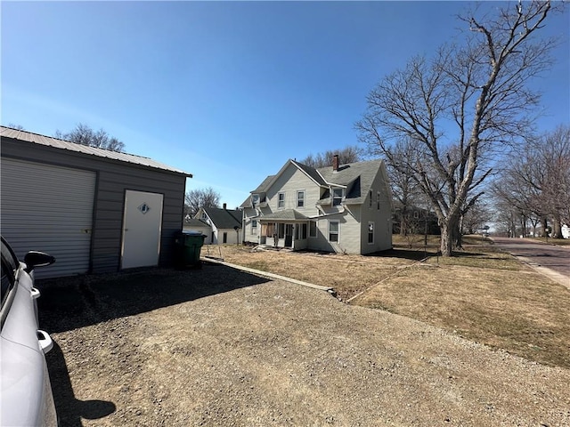 236 N Liberty St, Troy, KS 66087 - exterior space featuring an outbuilding and metal roof