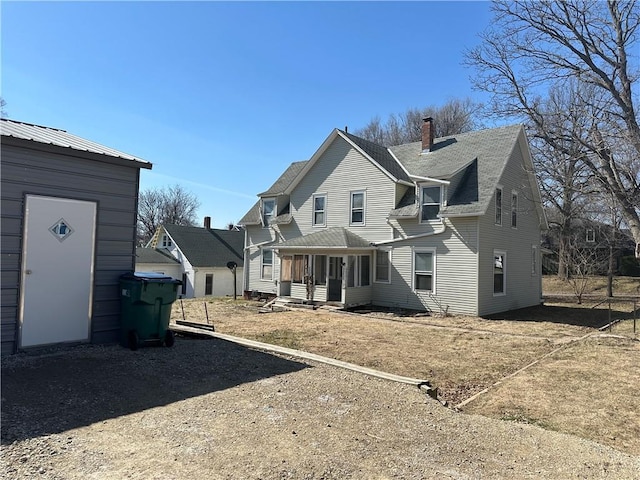 236 N Liberty St, Troy, KS 66087 - back of house with a chimney